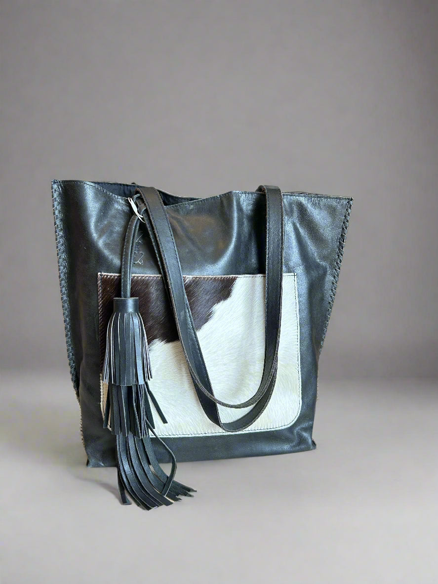 Leather tote with cowhide pocket
