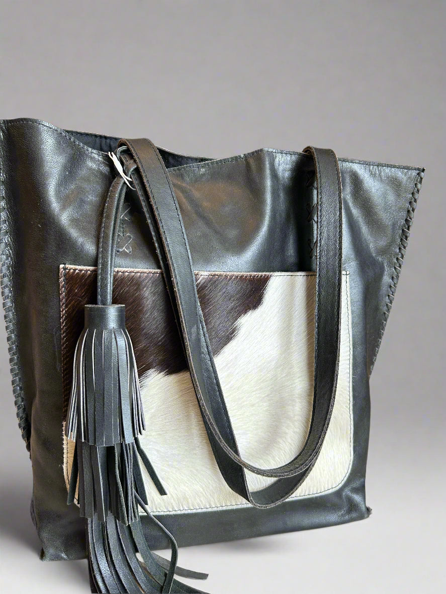 Leather tote with cowhide pocket