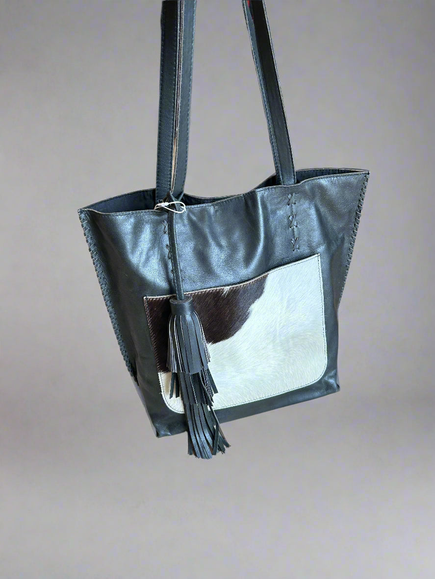 Leather tote with cowhide pocket